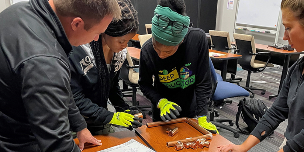 Baker Group employee engaging with students